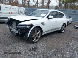 2023 Genesis GV80 z VIN KMUHBDSB8PU140123, wystawiony jako IAAI lot #41692036 z przebiegiem 37 021 mil mil oraz . Historia ofert i sprzedaży dostępna na DreamBid. Obrazek 2.