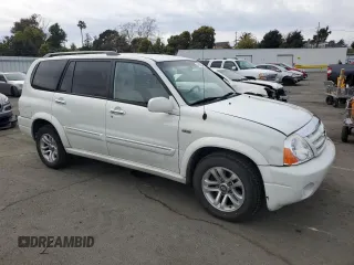 2004 Suzuki XL7 LX with VIN JS3TY92V844108854, listed as a Copart auction lot 49650735 with 201,373 mi miles and Salvage Title. Bid and sale history available at DreamBid. Image 4.