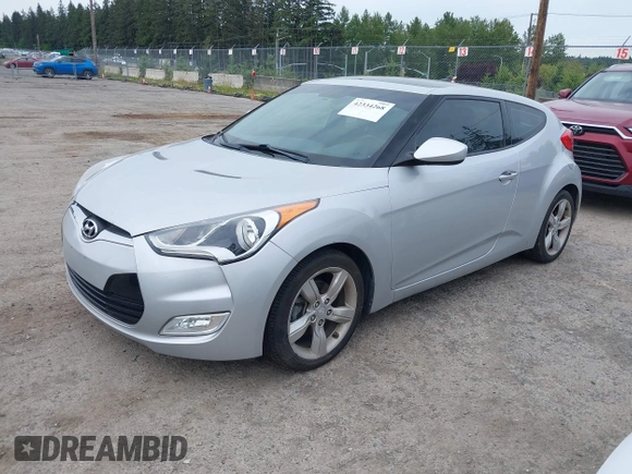 2014 Hyundai Veloster RE:FLEX z VIN KMHTC6AD6EU217282, wystawiony jako IAAI lot #42334268 z przebiegiem 68 473 mil mil oraz . Historia ofert i sprzedaży dostępna na DreamBid. Obrazek 2.