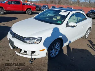 2015 Volkswagen Eos Komfort with VIN WVWBW8AH0FV001011, listed as a IAAI auction lot 41297299 with 81,444 mi miles and . Bid and sale history available at DreamBid. Image 2.