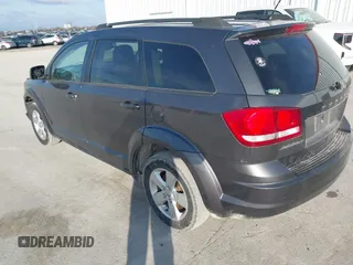 2014 Dodge Journey SE with VIN 3C4PDCAB0ET283756, listed as a IAAI auction lot 41490472 with 122,695 mi miles. Bid and sale history available at carsss.com. Image 3.