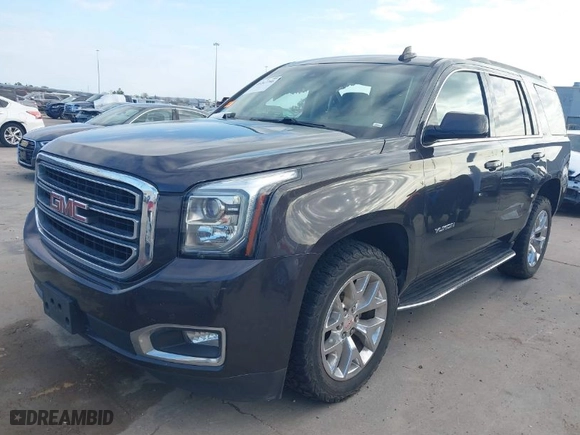 2016 GMC Yukon SLT with VIN 1GKS2BKC1GR406739, listed as a IAAI auction lot 41247286 with 106,023 mi miles. Bid and sale history available at carsss.com. Image 2.