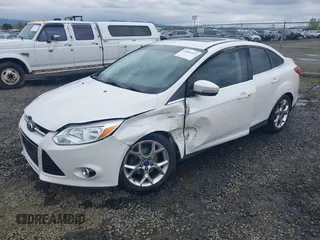 2014 Ford Focus Titanium with VIN 1FADP3J27EL142095, listed as a IAAI auction lot 42004419 with 139,515 mi miles. Bid and sale history available at carsss.com. Image 2.