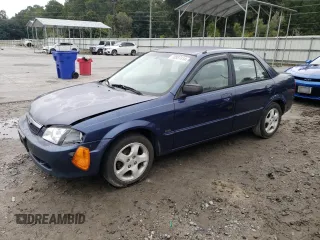 2000 Mazda Protege ES with VIN JM1BJ2214Y0283697, listed as a Copart auction lot 70587414 with 205,468 mi miles and Salvage Title. Bid and sale history available at DreamBid. Image 1.