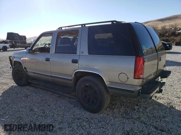 1998 GMC Yukon with VIN 1GKEK13R1WR508227, listed as a Copart auction lot 88325315 with 238,085 mi miles and Salvage Title. Bid and sale history available at carsss.com. Image 2.