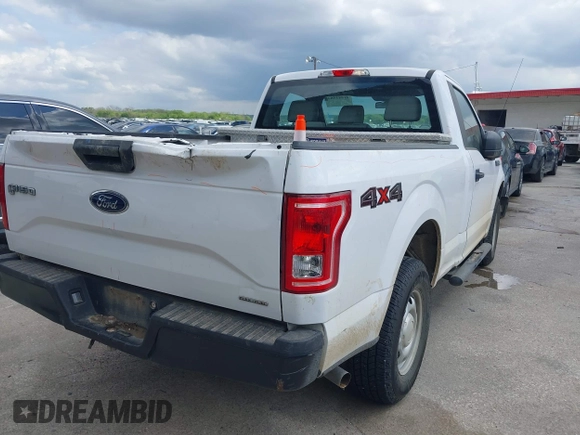 2015 Ford F-150 XL with VIN 1FTMF1E84FKD12758, listed as a IAAI auction lot 41841584 with 59,950 mi miles and . Bid and sale history available at DreamBid. Image 4.