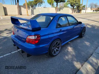 2005 Subaru Impreza Sedan (Natl) WRX STi w/Gold Wheels with VIN JF1GD70695L510603, listed as a Copart auction lot 48634505 with 145,565 mi miles and Salvage Title. Bid and sale history available at carsss.com. Image 4.