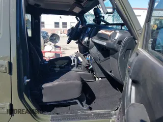 2015 Jeep Wrangler Unlimited Rubicon with VIN 1C4BJWFG0FL623431, listed as a IAAI auction lot 41651317 with 105,508 mi miles. Bid and sale history available at carsss.com. Image 5.