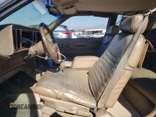 1988 Cadillac Eldorado z VIN 1G6EL115XJU611177, wystawiony jako Copart lot #46526855 z przebiegiem 122 780 mil mil oraz Szkody całkowita. Historia ofert i sprzedaży dostępna na DreamBid. Obrazek 7.