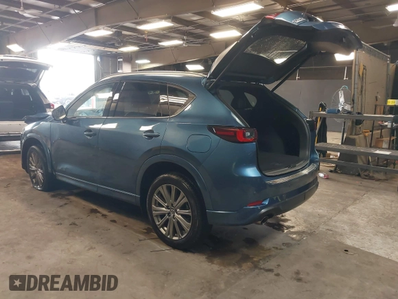 2023 Mazda CX-5 Signature with VIN JM3KFBXY4P0120187, listed as a IAAI auction lot 41706264 with 9,402 mi miles and . Bid and sale history available at carsss.com. Image 3.