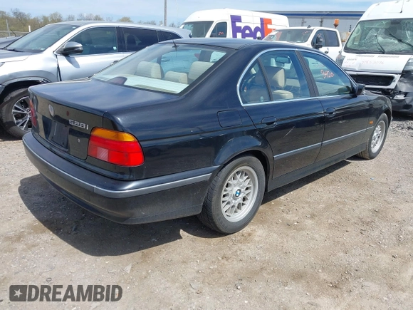 1999 BMW 5 Series 528iA with VIN WBADM6331XBY29010, listed as a IAAI auction lot 42103420 with 196,575 mi miles. Bid and sale history available at carsss.com. Image 4.