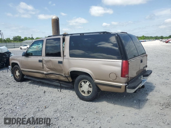 1999 Chevrolet Suburban with VIN 3GNEC16R6XG205408, listed as a Copart auction lot 57169415 with 303,412 mi miles and Salvage title. Bid and sale history available at DreamBid. Image 2.