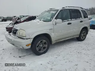 2003 Suzuki Grand Vitara z VIN JS3TD62V634107209, wystawiony jako Copart lot #83019744 z przebiegiem 219 180 mil mil oraz Szkody całkowita. Historia ofert i sprzedaży dostępna na DreamBid. Obrazek 1.