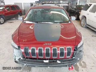2016 Jeep Cherokee Trailhawk with VIN 1C4PJMBBXGW135138, listed as a IAAI auction lot 41595718 with 267,058 mi miles. Bid and sale history available at carsss.com. Image 12.