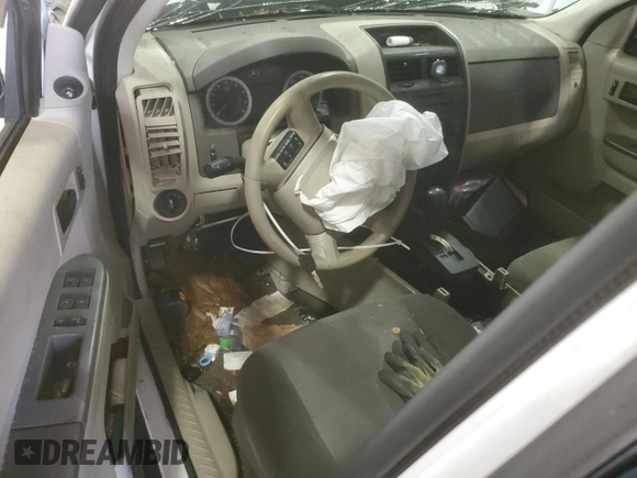 2010 Ford Escape XLS with VIN 1FMCU9C75AKD02318, listed as a Copart auction lot 59130055 with Not provided miles and Salvage title. Bid and sale history available at DreamBid. Image 8.