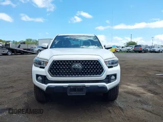2018 Toyota Tacoma SR5 with VIN 3TMDZ5BN5JM048038, listed as a IAAI auction lot 42084922 with 79,718 mi miles and . Bid and sale history available at DreamBid. Image 12.