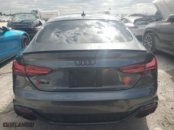2024 Audi RS 5 Sportback with VIN WUAAWCF54RA900689, listed as a Copart auction lot 77674404 with 7,496 mi miles and Non Repairable. Bid and sale history available at carsss.com. Image 6.