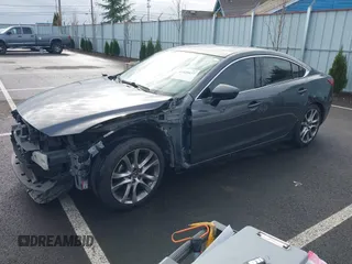 2014 Mazda 6 i Grand Touring with VIN JM1GJ1W63E1147380, listed as a IAAI auction lot 41928637 with 140,091 mi miles and . Bid and sale history available at DreamBid. Image 19.