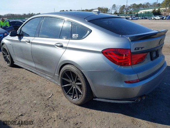 2011 BMW 5 Series Gran Turismo 550i xDrive with VIN WBASP4C52BC341644, listed as a IAAI auction lot 41694573 with 202,983 mi miles. Bid and sale history available at carsss.com. Image 3.