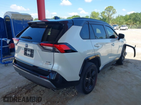 2021 Toyota RAV4 Hybrid XSE with VIN 2T3E6RFV9MW019837, listed as a IAAI auction lot 42002574 with 74,214 mi miles. Bid and sale history available at carsss.com. Image 4.