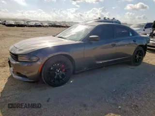 2020 Dodge Charger SXT with VIN 2C3CDXBG1LH152930, listed as a Copart auction lot 61595755 with 57,087 mi miles and Salvage title. Bid and sale history available at DreamBid. Image 1.