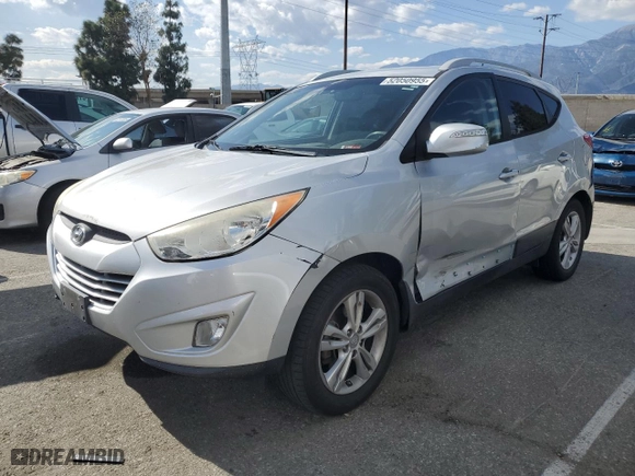 2013 Hyundai Tucson GLS with VIN KM8JU3AC4DU737909, listed as a Copart auction lot 52050955 with 130,707 mi miles and Salvage Title. Bid and sale history available at carsss.com. Image 1.