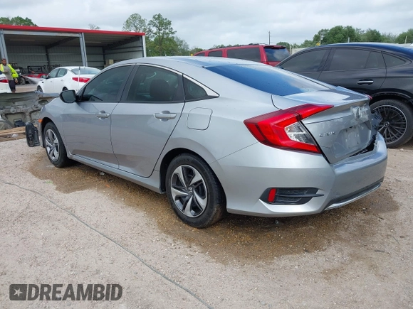 2019 Honda Civic LX with VIN 19XFC2F60KE043806, listed as a IAAI auction lot 41915894 with 123,141 mi miles and . Bid and sale history available at DreamBid. Image 3.