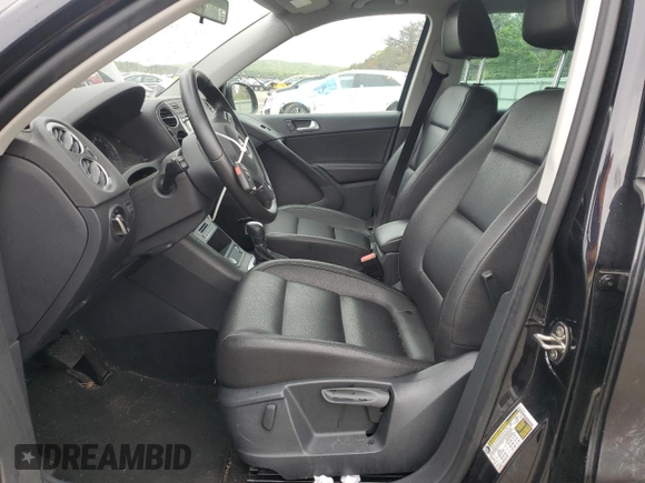 2014 Volkswagen Tiguan S z VIN WVGBV3AX5EW554500, wystawiony jako Copart lot #57016775 z przebiegiem 91 101 mil mil oraz Szkoda całkowita • Salvage title. Historia ofert i sprzedaży dostępna na DreamBid. Obrazek 7.