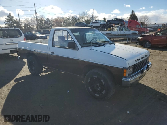 1987 Nissan Hardbody E z VIN JN6ND11S4HW011430, wystawiony jako Copart lot #81785214 z przebiegiem 334 566 mil mil oraz Tytuł czysty. Historia ofert i sprzedaży dostępna na DreamBid. Obrazek 4.