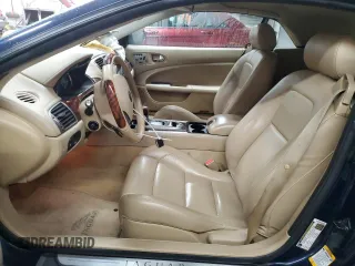 2007 Jaguar XK with VIN SAJDA44BX75B00447, listed as a Copart auction lot 50147695 with 119,467 mi miles and Salvage Title. Bid and sale history available at carsss.com. Image 7.