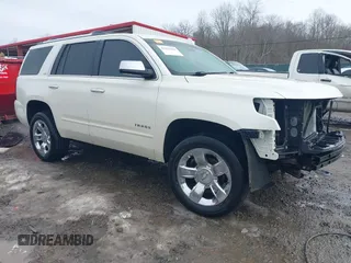 2015 Chevrolet Tahoe LTZ with VIN 1GNSKCKC9FR565368, listed as a IAAI auction lot 41453462 with 99,090 mi miles and . Bid and sale history available at DreamBid. Image 1.