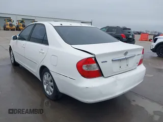 2003 Toyota Camry LE z VIN JTDBF30K530148403, wystawiony jako IAAI lot #41688346 z przebiegiem 299 143 mil mil oraz . Historia ofert i sprzedaży dostępna na DreamBid. Obrazek 3.