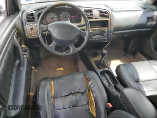 1999 Infiniti G20 z VIN JNKCP11A8XT015021, wystawiony jako Copart lot #67966844 z przebiegiem 268 922 mil mil oraz Szkody całkowita. Historia ofert i sprzedaży dostępna na DreamBid. Obrazek 8.