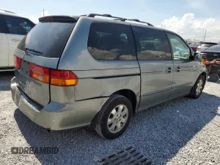2002 Honda Odyssey EX-L with VIN 2HKRL18962H552809, listed as a Copart auction lot 63631115 with 224,019 mi miles and Salvage title. Bid and sale history available at DreamBid. Image 3.