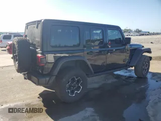 2023 Jeep Wrangler Rubicon z VIN 1C4JJXR62PW663711, wystawiony jako Copart lot #54816255 z przebiegiem 29 123 mil mil oraz Szkoda całkowita • Salvage title. Historia ofert i sprzedaży dostępna na DreamBid. Obrazek 3.