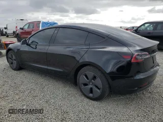 2022 Tesla Model 3 Long Range with VIN 5YJ3E1EB6NF334914, listed as a Copart auction lot 53876415 with 52,875 mi miles and Salvage Title. Bid and sale history available at carsss.com. Image 2.