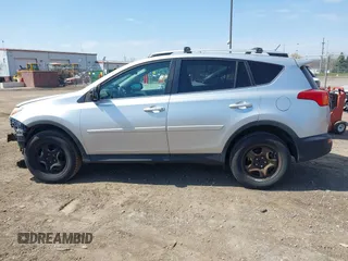 2014 Toyota RAV4 LE with VIN 2T3BFREV4EW136537, listed as a IAAI auction lot 42065728 with 211,039 mi miles and . Bid and sale history available at DreamBid. Image 15.