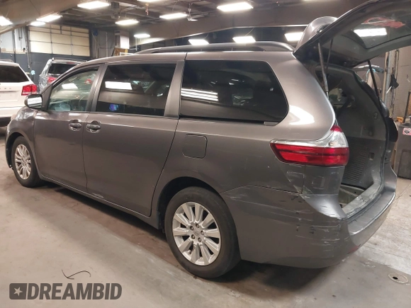 2015 Toyota Sienna XLE with VIN 5TDYK3DC3FS677780, listed as a IAAI auction lot 42155459 with 102,355 mi miles. Bid and sale history available at carsss.com. Image 3.