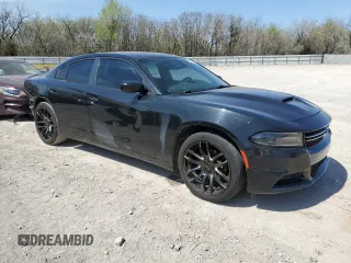 2015 Dodge Charger SE with VIN 2C3CDXBG3FH722124, listed as a Copart auction lot 50541805 with 106,847 mi miles and Salvage Title. Bid and sale history available at carsss.com. Image 4.