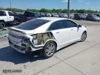2014 Lincoln MKZ Hybrid with VIN 3LN6L2LU3ER819681, listed as a IAAI auction lot 41867338 with 149,964 mi miles. Bid and sale history available at carsss.com. Image 4.