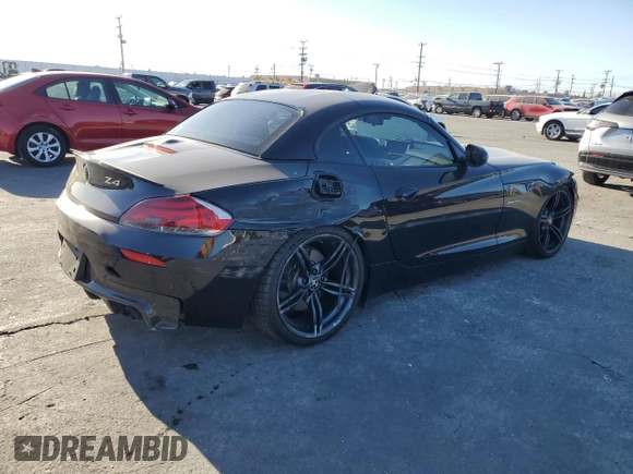 2011 BMW Z4 sDrive35is with VIN WBALM1C58BE393909, listed as a Copart auction lot 89218305 with 112,502 mi miles and Salvage title. Bid and sale history available at DreamBid. Image 3.