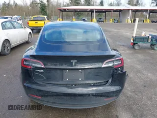 2019 Tesla Model 3 Mid Range with VIN 5YJ3E1EA4KF305611, listed as a IAAI auction lot 41916738 with 59,101 mi miles and . Bid and sale history available at carsss.com. Image 16.