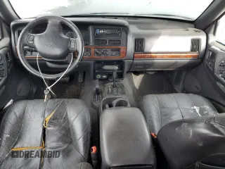 1997 Jeep Grand Cherokee Limited with VIN 1J4GZ78Y1VC706353, listed as a Copart auction lot 41437085 with 163,675 mi miles and Salvage Title. Bid and sale history available at carsss.com. Image 8.