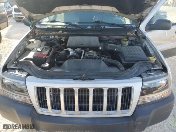 2004 Jeep Grand Cherokee Laredo with VIN 1J4GX48N74C406647, listed as a Copart auction lot 77631654 with 174,824 mi miles and Salvage Title. Bid and sale history available at carsss.com. Image 12.