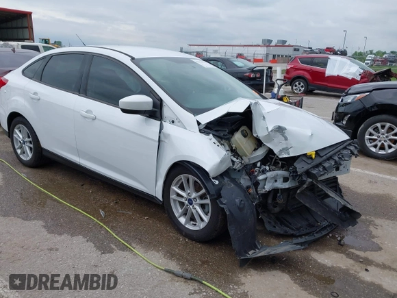 2018 Ford Focus SE z VIN 1FADP3F21JL257262, wystawiony jako IAAI lot #42174952 z przebiegiem 138 872 mil mil oraz . Historia ofert i sprzedaży dostępna na DreamBid. Obrazek 1.