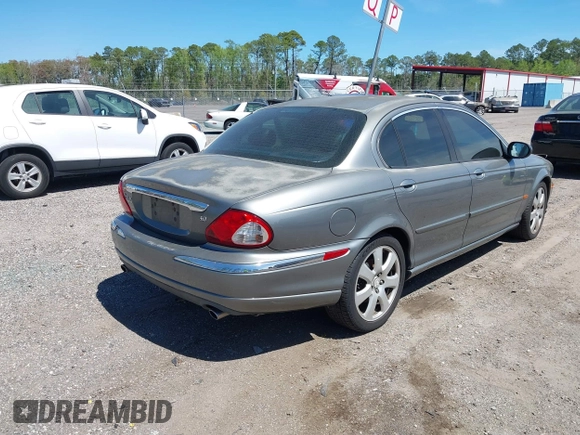 2004 Jaguar X-Type with VIN SAJEA51C04WD73023, listed as a IAAI auction lot 41874488 with 199,333 mi miles and . Bid and sale history available at DreamBid. Image 4.