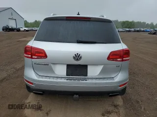 2014 Volkswagen Touareg Sport с VIN WVGEF9BP0ED014429, выставлен на аукционе Copart как лот 58692875 с пробегом 157 417 миль миль и Списание • Salvage title. История ставок и продаж доступна на DreamBid. Изображение 6.