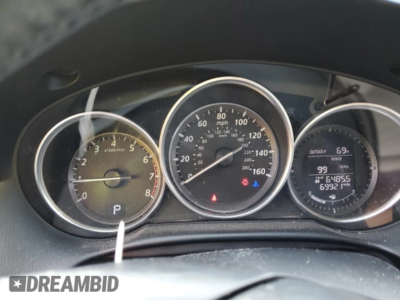 2014 Mazda CX-5 Touring with VIN JM3KE2CY6E0316041, listed as a Copart auction lot 52227835 with 69,921 mi miles and Salvage Title. Bid and sale history available at DreamBid. Image 9.