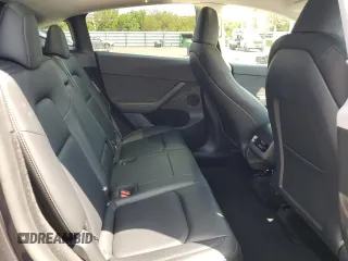 2025 Tesla Model Y Long Range with VIN 7SAYGDED8SF241779, listed as a Copart auction lot 51899205 with 12,409 mi miles and Salvage Title. Bid and sale history available at DreamBid. Image 11.