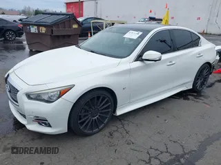 2014 Infiniti Q50 Premium z VIN JN1BV7AP8EM671403, wystawiony jako IAAI lot #41837716 z przebiegiem 115 058 mil mil oraz . Historia ofert i sprzedaży dostępna na DreamBid. Obrazek 21.